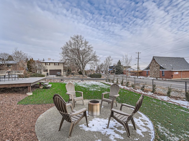 view of patio / terrace featuring a fire pit and a wooden deck