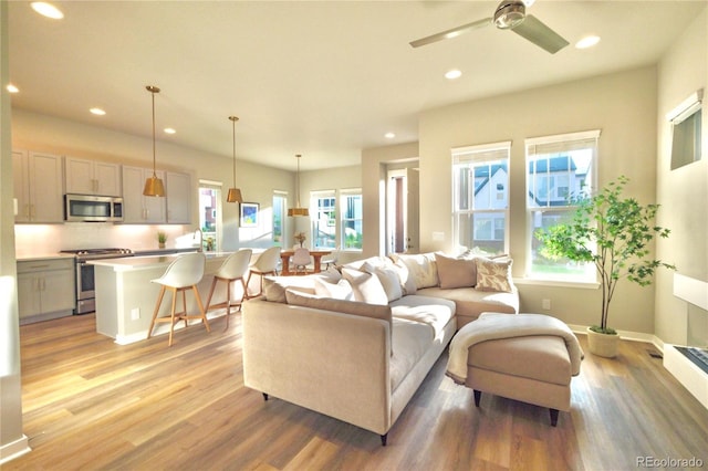 1919 W 165th Way, Broomfield, CO 80023 - living area with recessed lighting, light wood finished floors, and a ceiling fan