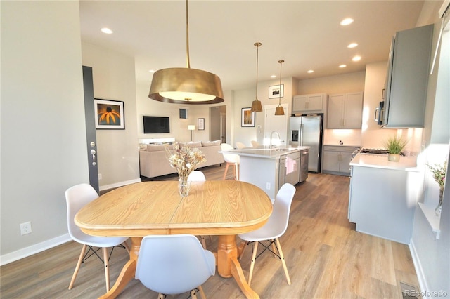 1919 W 165th Way, Broomfield, CO 80023 - dining area featuring wood finished floors and recessed lighting