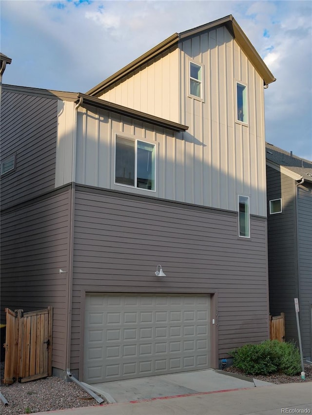 1919 W 165th Way, Broomfield, CO 80023 - view of property exterior featuring a garage, board and batten siding, and concrete driveway