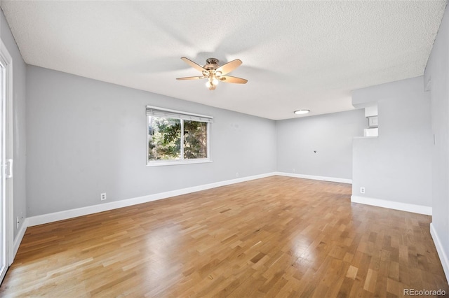 7495 E Quincy Ave Unit 208, Denver, CO 80237 - empty room with a ceiling fan, light wood-type flooring, and a textured ceiling
