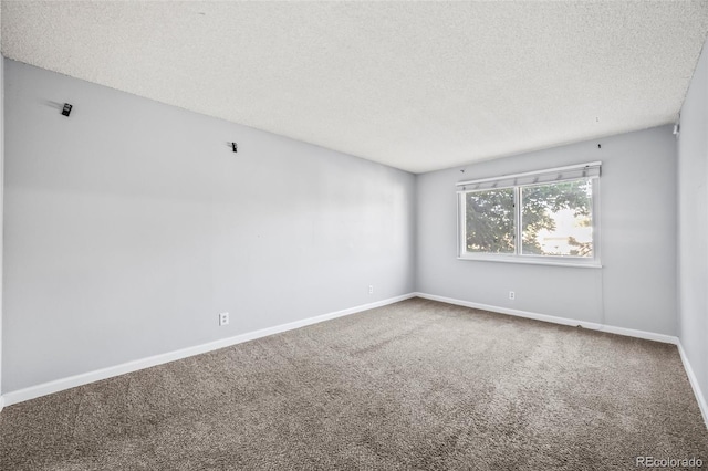7495 E Quincy Ave Unit 208, Denver, CO 80237 - carpeted empty room featuring a textured ceiling and baseboards