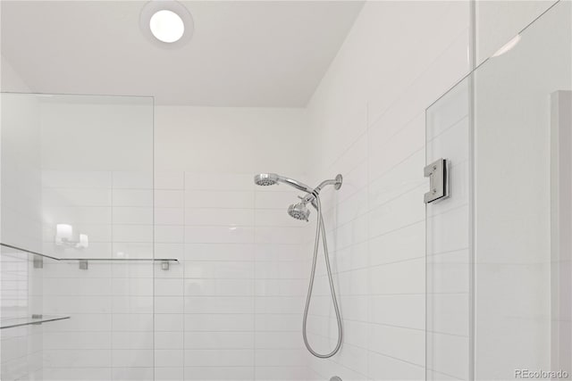 full bathroom with a tile shower