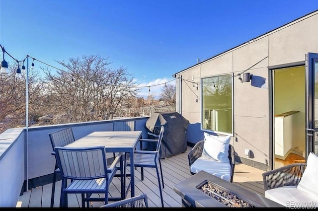 4035 Fenton Ct, Wheat Ridge, CO 80212 - wooden deck with a fire pit, outdoor dining space, and area for grilling