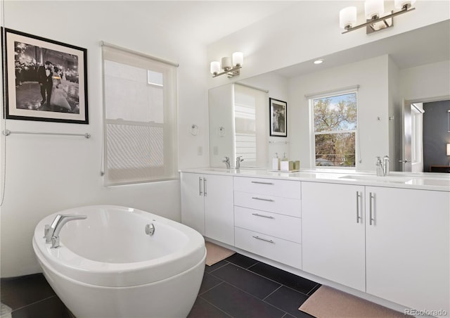 4035 Fenton Ct, Wheat Ridge, CO 80212 - full bathroom featuring a freestanding tub, double vanity, and tile patterned flooring