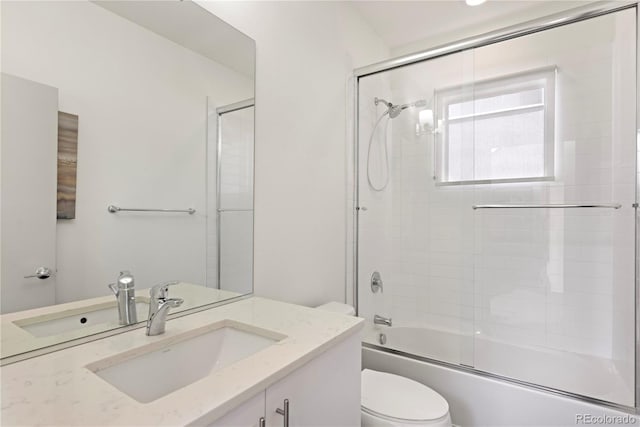 4035 Fenton Ct, Wheat Ridge, CO 80212 - bathroom with toilet, vanity, and enclosed tub / shower combo