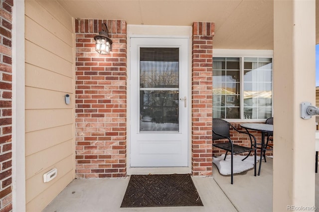 4821 N Silverlace Dr, Castle Rock, CO 80109 - doorway to property with covered porch and brick siding