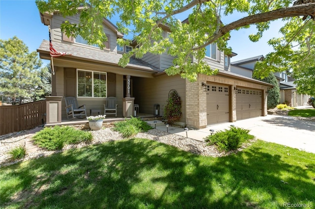 3791 Charterwood Cir, Highlands Ranch, CO 80126 - view of front of house with an attached garage, concrete driveway, and covered porch