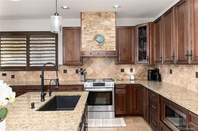 3791 Charterwood Cir, Highlands Ranch, CO 80126 - kitchen featuring appliances with stainless steel finishes, a sink, backsplash, light stone countertops, and recessed lighting