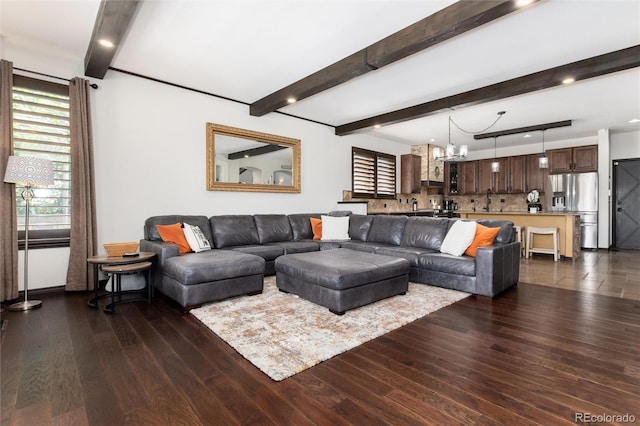 3791 Charterwood Cir, Highlands Ranch, CO 80126 - living area with dark wood-style flooring, beam ceiling, and a chandelier