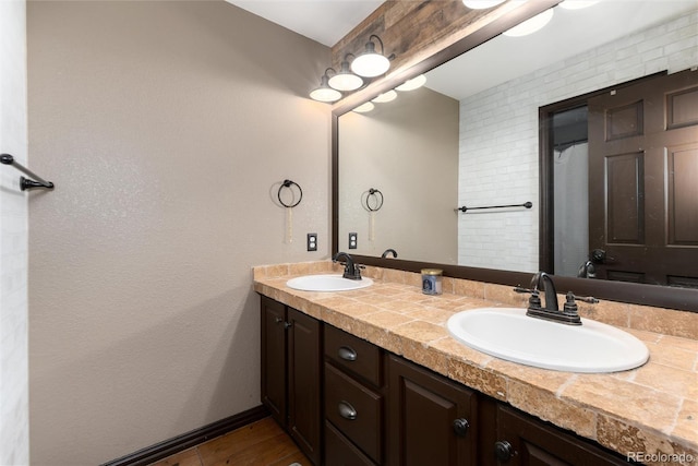 3791 Charterwood Cir, Highlands Ranch, CO 80126 - bathroom with double vanity and wood finished floors