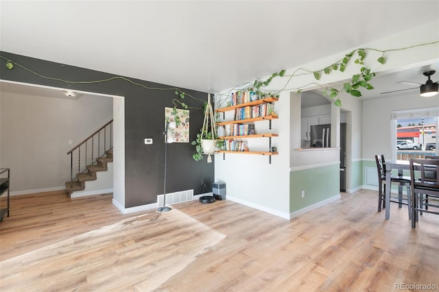 interior space featuring ceiling fan and wood-type flooring