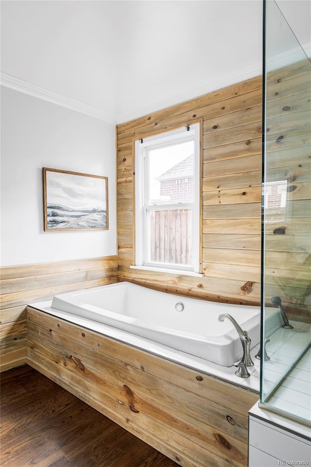 4828 W 32nd Ave, Denver, CO 80212 - bathroom with a bath, wood finished floors, and ornamental molding
