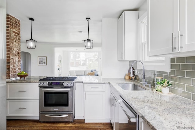 4828 W 32nd Ave, Denver, CO 80212 - kitchen with a sink, stainless steel gas range oven, dishwashing machine, and light stone countertops