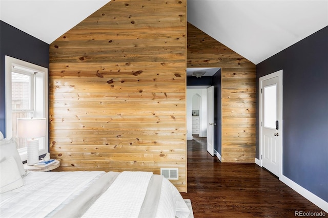 4828 W 32nd Ave, Denver, CO 80212 - bedroom with baseboards, dark wood finished floors, visible vents, wood walls, and high vaulted ceiling