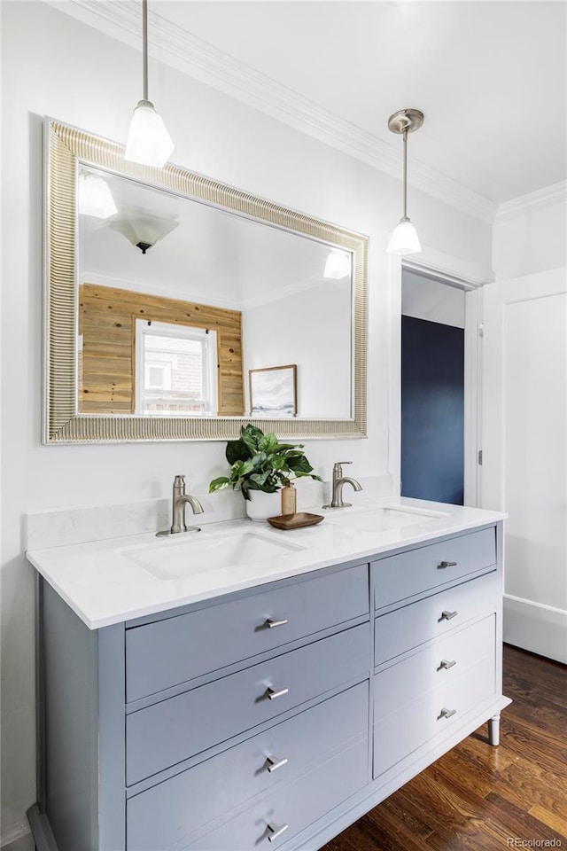 4828 W 32nd Ave, Denver, CO 80212 - full bath with wood finished floors, crown molding, a sink, and double vanity
