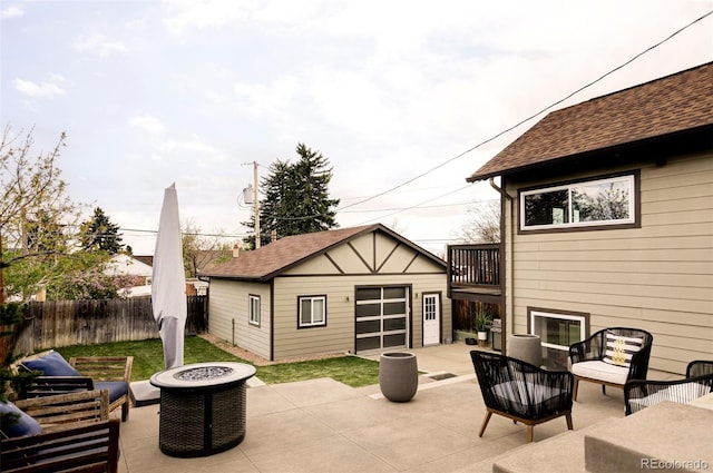 4828 W 32nd Ave, Denver, CO 80212 - view of patio / terrace featuring an outdoor living space with a fire pit, fence, and an outbuilding