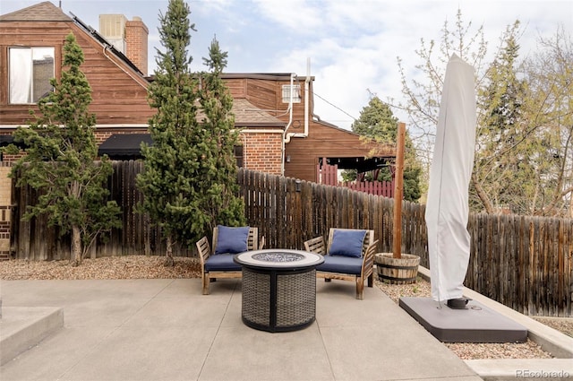 4828 W 32nd Ave, Denver, CO 80212 - view of patio featuring an outdoor fire pit and fence