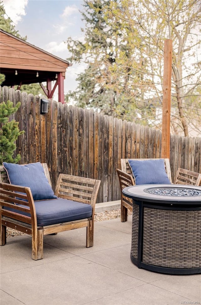 4828 W 32nd Ave, Denver, CO 80212 - view of patio / terrace featuring an outdoor fire pit and fence