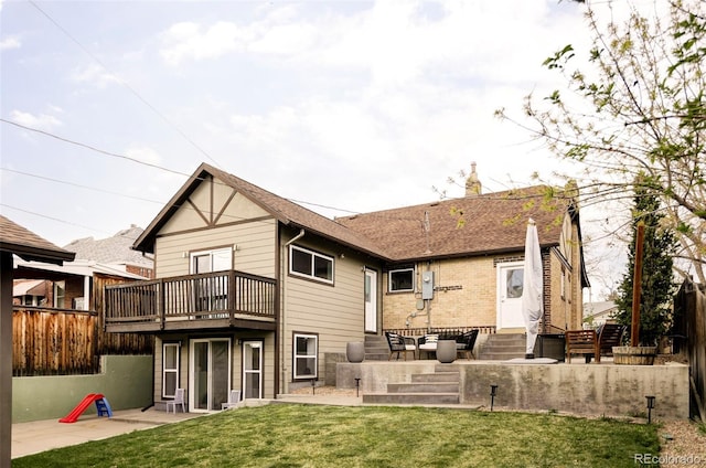 4828 W 32nd Ave, Denver, CO 80212 - rear view of property featuring a patio, a wooden deck, a yard, brick siding, and entry steps