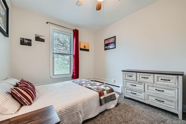 3127 W 28th Ave Unit 2, Denver, CO 80211 - bedroom with baseboards, baseboard heating, ceiling fan, and dark carpet