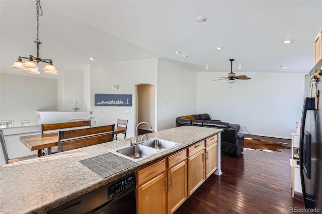 5534 Killarney St, Denver, CO 80249 - kitchen with a sink, dishwasher, arched walkways, dark wood finished floors, and a ceiling fan
