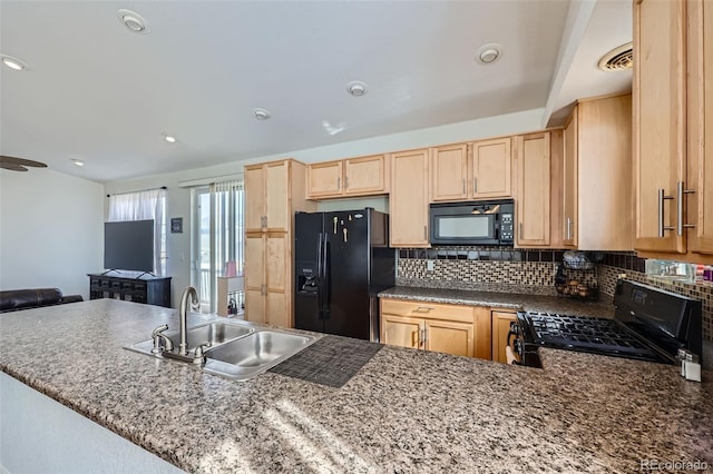 5534 Killarney St, Denver, CO 80249 - kitchen with a sink, light brown cabinets, decorative backsplash, and black appliances