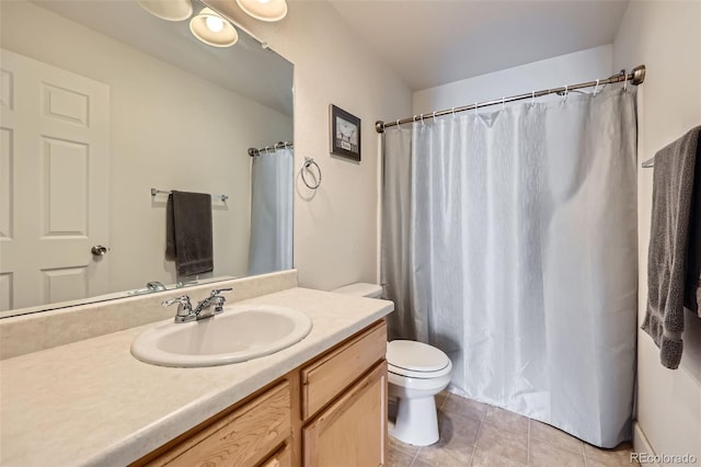 5534 Killarney St, Denver, CO 80249 - bathroom with a shower with curtain, tile patterned floors, vanity, and toilet
