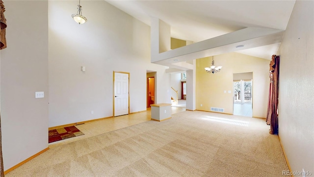 spare room with visible vents, stairway, carpet flooring, high vaulted ceiling, and baseboards