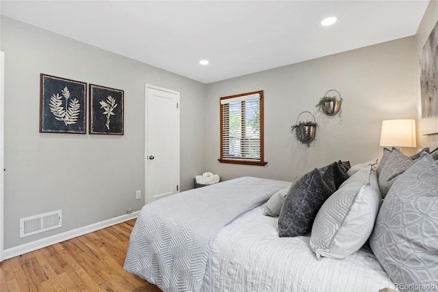 bedroom featuring light hardwood / wood-style floors