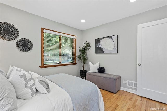 bedroom with light hardwood / wood-style floors