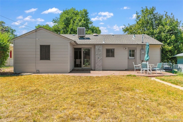 back of house featuring a yard, a patio area, and central air condition unit