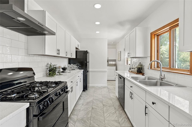 kitchen featuring wall chimney exhaust hood, white cabinetry, and black appliances