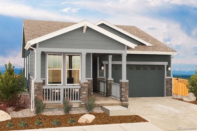 craftsman house with a shingled roof, a porch, concrete driveway, a garage, and stone siding