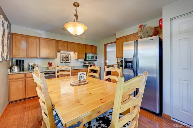 7261 S Colorado Ct, Centennial, CO 80122 - dining area featuring light wood finished floors