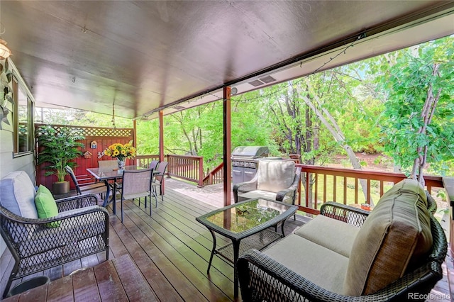 7261 S Colorado Ct, Centennial, CO 80122 - wooden terrace featuring outdoor dining space, an outdoor living space, and a grill