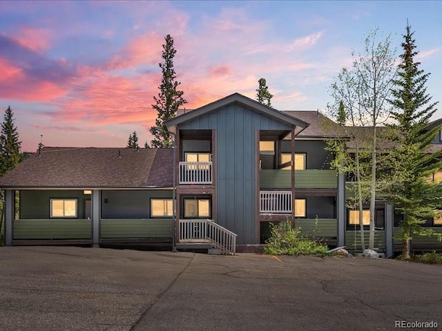 10000 Ryan Gulch Rd Unit 116, Silverthorne, CO 80498 - view of front of home featuring board and batten siding, a balcony, and roof with shingles
