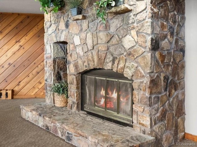 10000 Ryan Gulch Rd Unit 116, Silverthorne, CO 80498 - detailed view of a fireplace, carpet, and wooden walls
