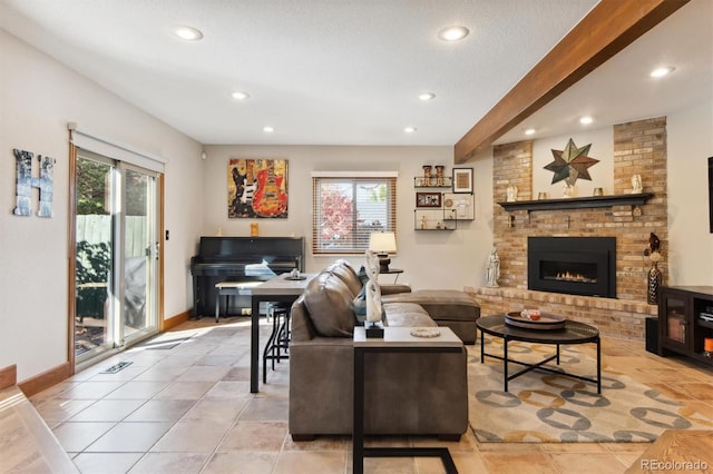 living room with a healthy amount of sunlight, light tile patterned flooring, a fireplace, and beam ceiling