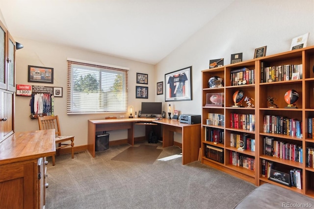 office area with vaulted ceiling and light carpet