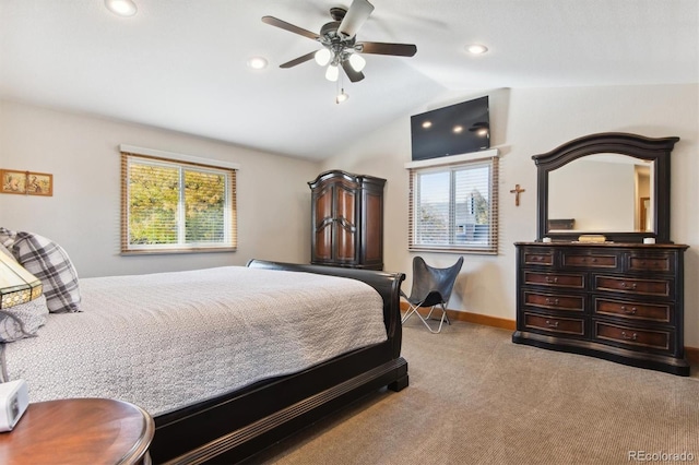 carpeted bedroom with lofted ceiling, ceiling fan, and multiple windows