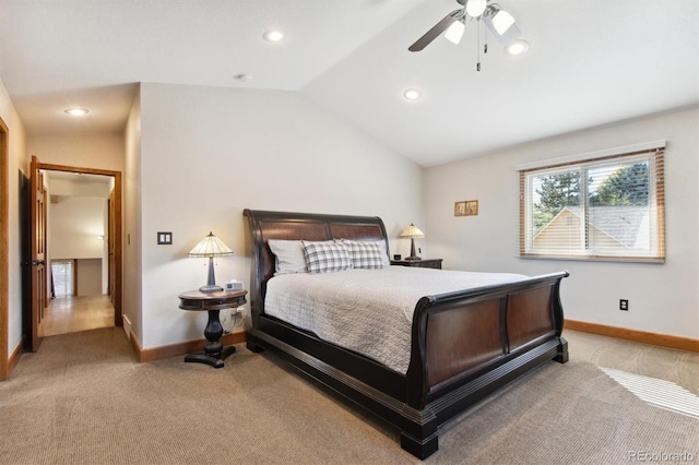 bedroom featuring lofted ceiling, ceiling fan, and light carpet