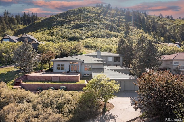 11039 Roxborough Dr, Littleton, CO 80125 - view of mountain backdrop with a heavily wooded area