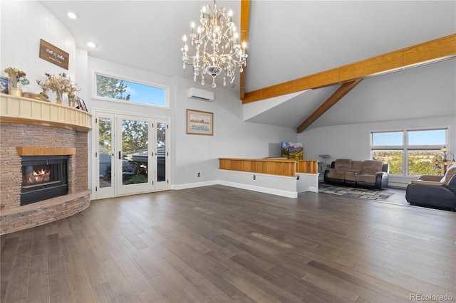11039 Roxborough Dr, Littleton, CO 80125 - living room featuring high vaulted ceiling, a chandelier, a glass covered fireplace, recessed lighting, and dark wood-style flooring