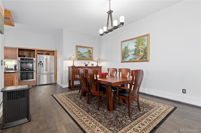11039 Roxborough Dr, Littleton, CO 80125 - dining room with dark wood-style floors, a baseboard heating unit, a chandelier, and baseboards