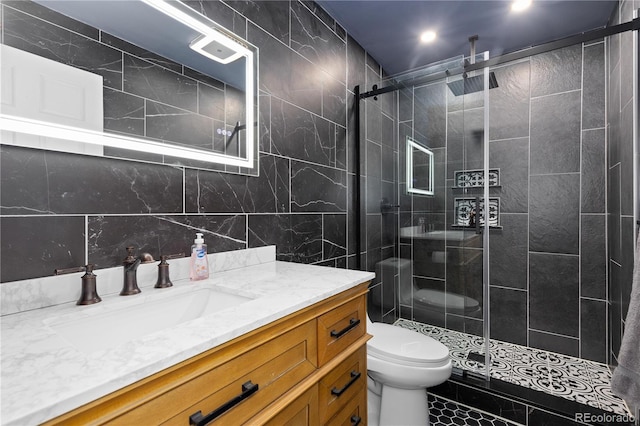 11039 Roxborough Dr, Littleton, CO 80125 - bathroom featuring tile walls, vanity, toilet, and a stall shower