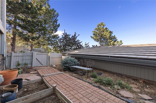 11039 Roxborough Dr, Littleton, CO 80125 - view of patio with a gate and a garden