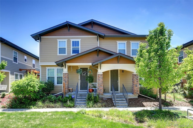 3450 Valentia St, Denver, CO 80238 - craftsman house featuring a porch