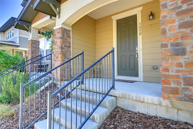 3450 Valentia St, Denver, CO 80238 - property entrance featuring brick siding
