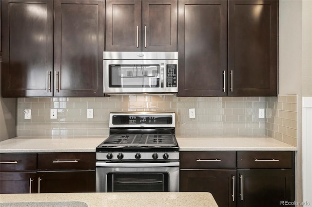 3450 Valentia St, Denver, CO 80238 - kitchen with appliances with stainless steel finishes, dark brown cabinets, and backsplash